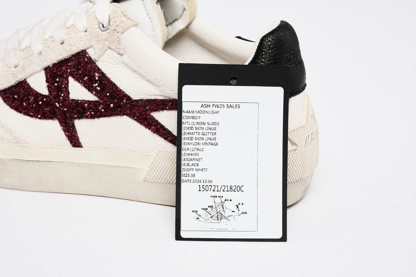 White Sneaker With Purple Detail