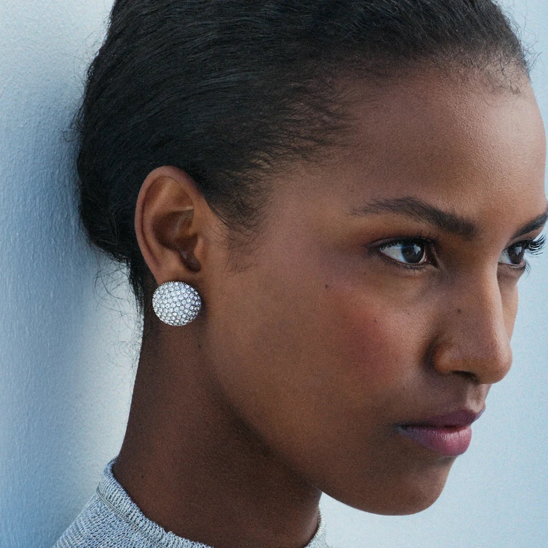 Edblad Bead Sparkle Stud Earrings In Steel, styled and worn on a model