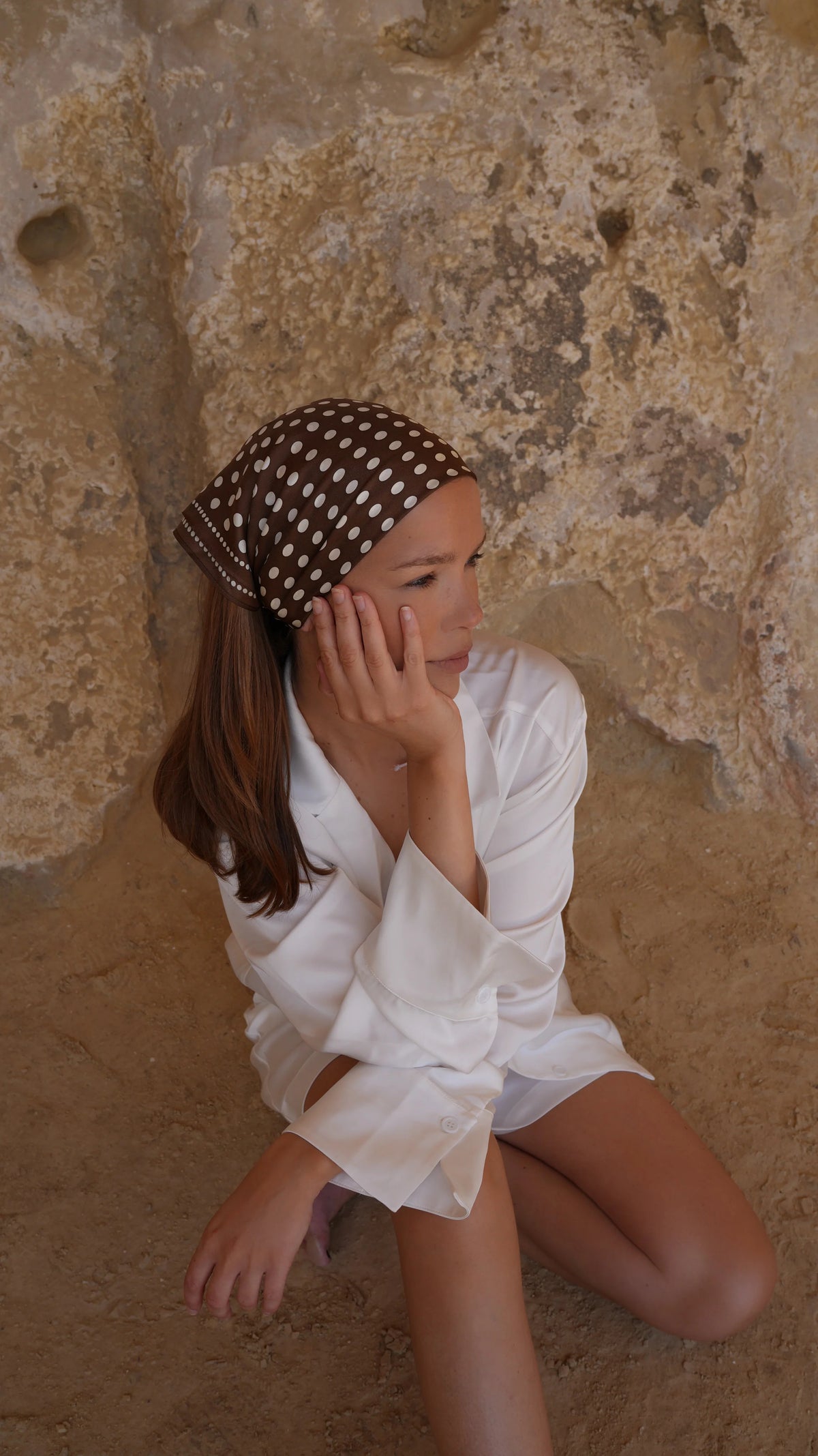 Polkadot Scarf in Brown by Lescarf worn as a headscarf with a white shirt