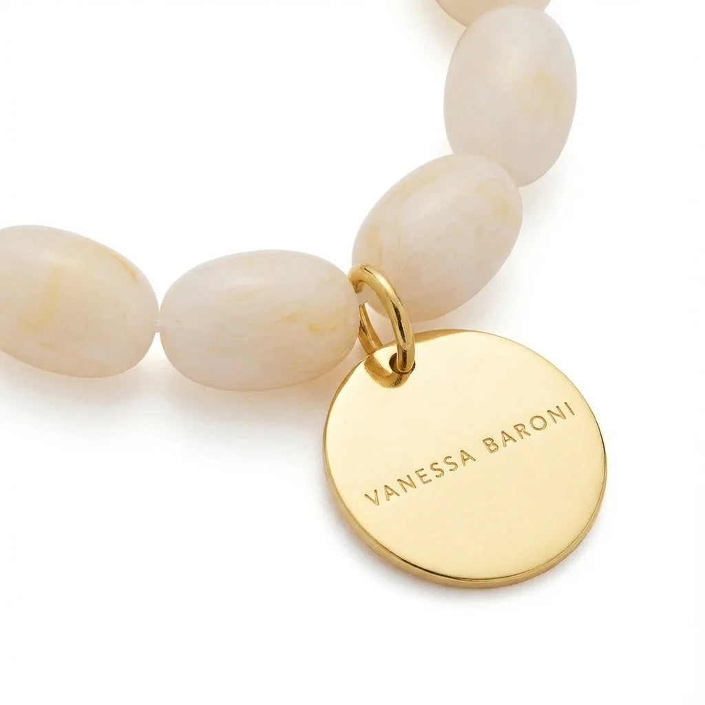 Close-up of the Olive Flex Bracelet Pearl Marble by Vanessa Baroni showing the oval beads and gold disc