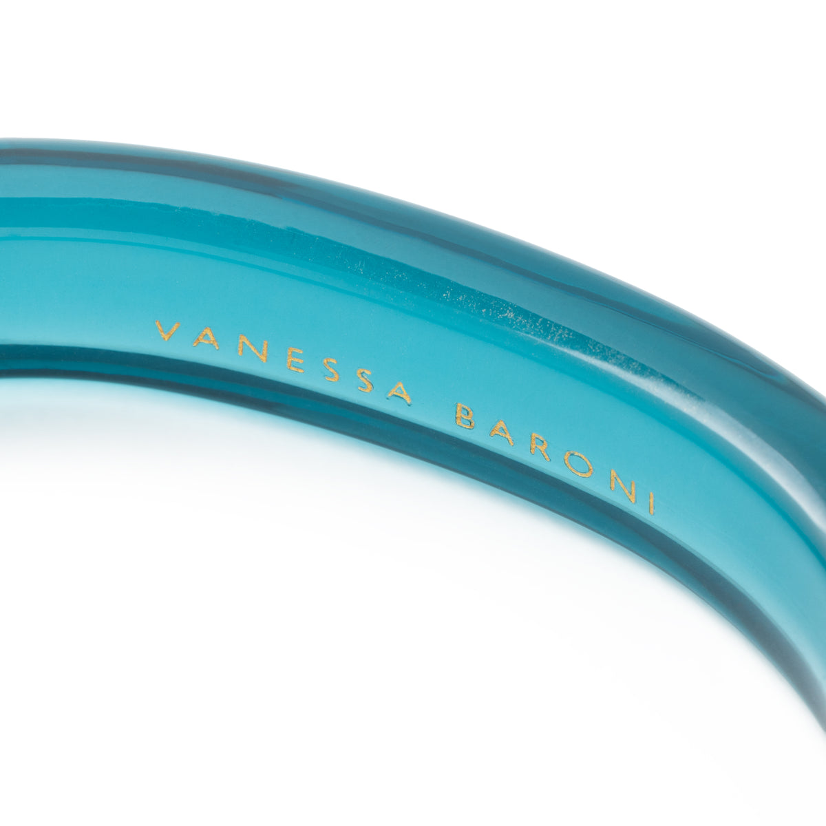Close-up of the Soft Edge Bangle In Clear Teal by Vanessa Baroni showing the material and finish
