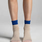 Aydo Studios Altai Route socks in Silent Dune, worn front view