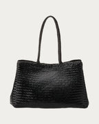 ALEO Romy Woven Tote in Black, front view with braided handles, on soft stone background