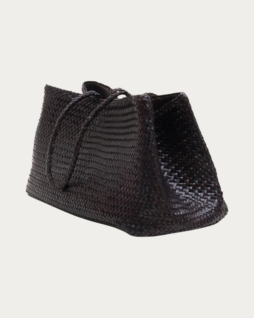 ALEO Romy Woven Tote in Crema, three-quarter view showing the woven side, on soft stone background