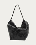 ALEO Toka Woven Tote in Black, front view with open top and woven strap, on soft stone background