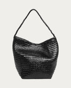 ALEO Toka Woven Tote in Black, front view with tubular woven shoulder strap, on soft stone background