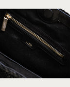 ALEO Toka Woven Tote in Black, interior close-up of the zip pocket and ALEO embossed branding