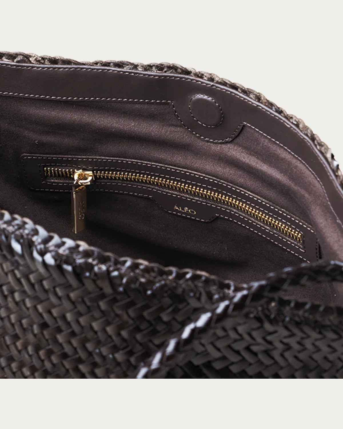 ALEO Toka Woven Tote in Crema, interior close-up of the zip pocket and ALEO embossed branding
