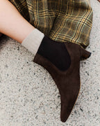 Anonymous Copenhagen Gaby 40 coffee brown suede ankle boot worn with a checked skirt and cream sock
