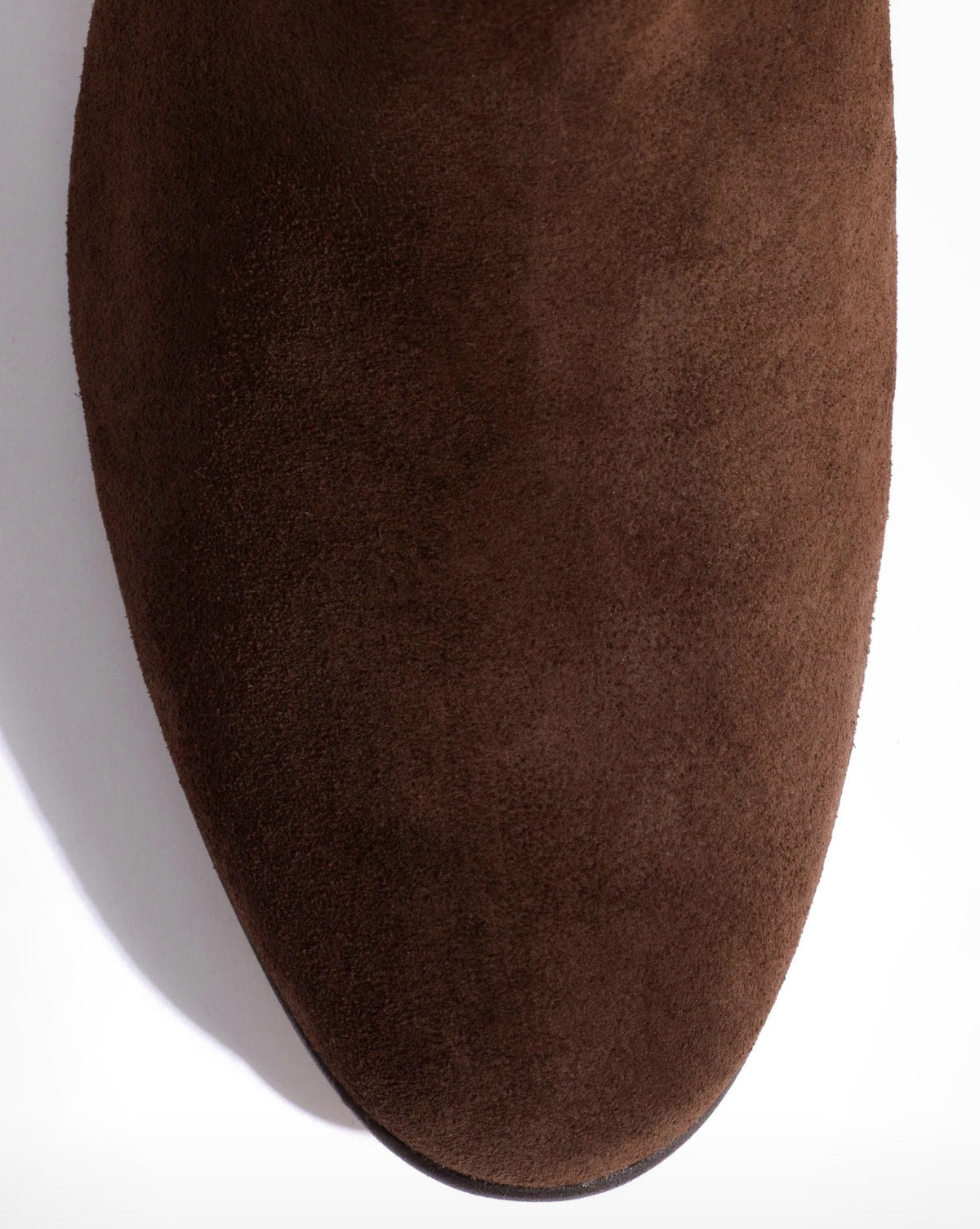 Close-up of the chocolate calf suede toe of the Anonymous Copenhagen Lully 55 boot