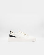 Ash Free white platform sneaker with black heel panel and zebra-print heel tab, side profile