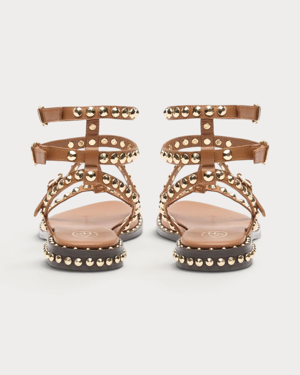 Amari Shoes & Fashion Cork cinnamon gladiator sandals with gold studded straps and buckle closures, back view