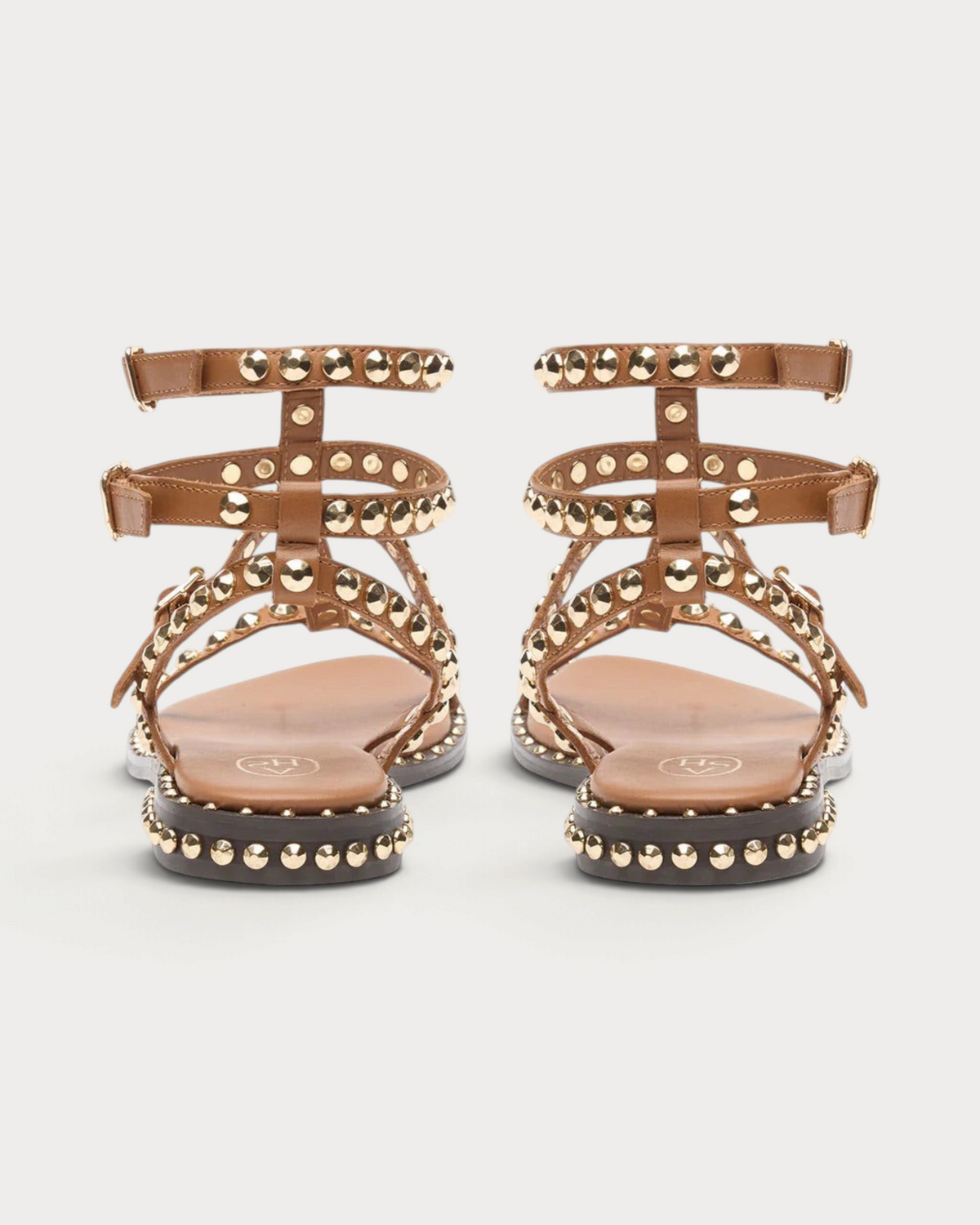 Amari Shoes & Fashion Cork cinnamon gladiator sandals with gold studded straps and buckle closures, back view