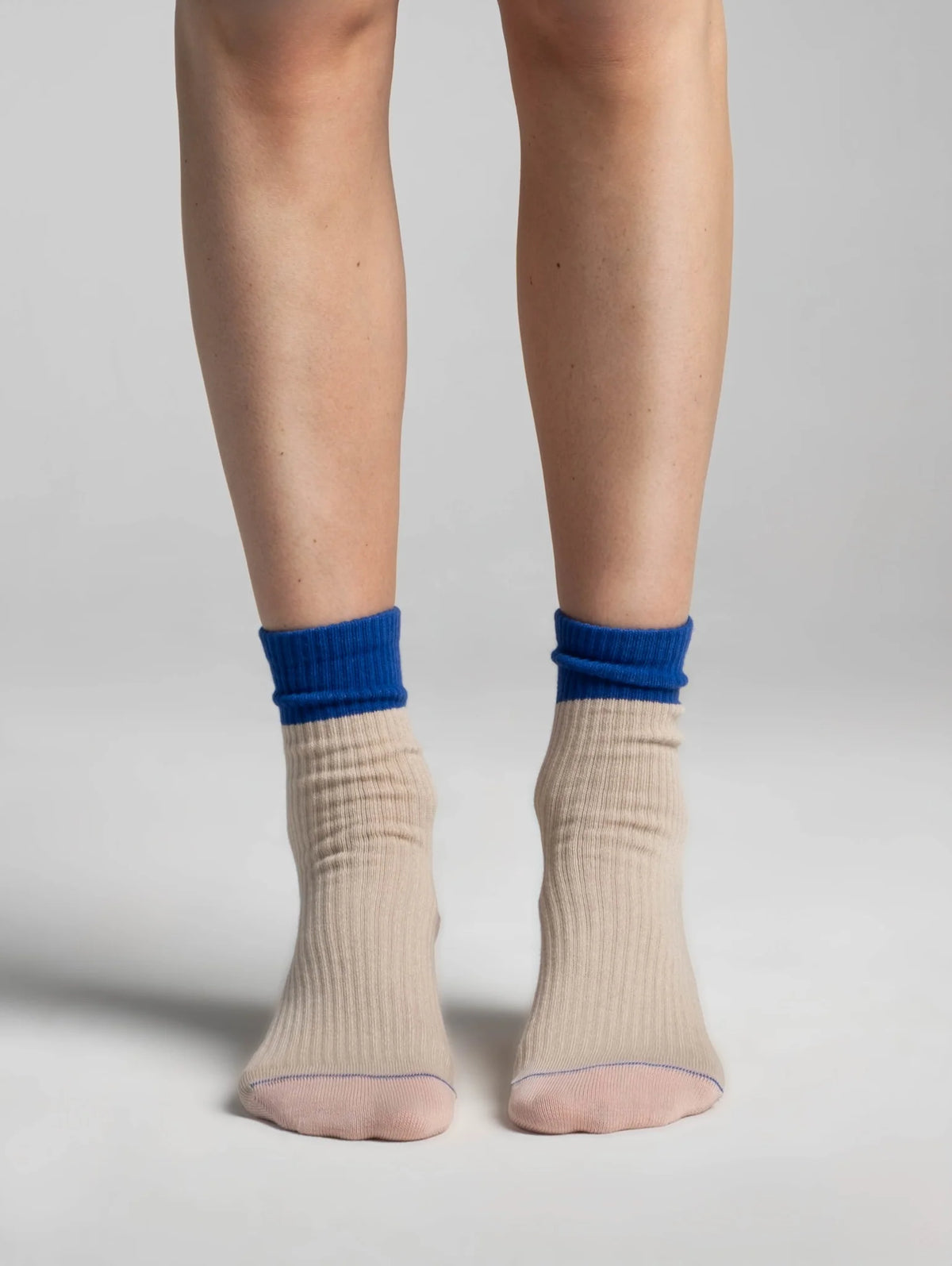 Aydo Studios Altai Route socks in Silent Dune, worn front view