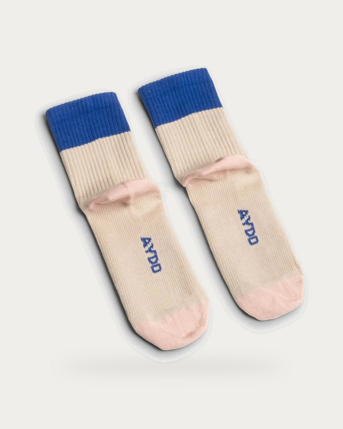 Aydo Studios Altai Route Silent Dune Socks – pair of socks on soft stone background