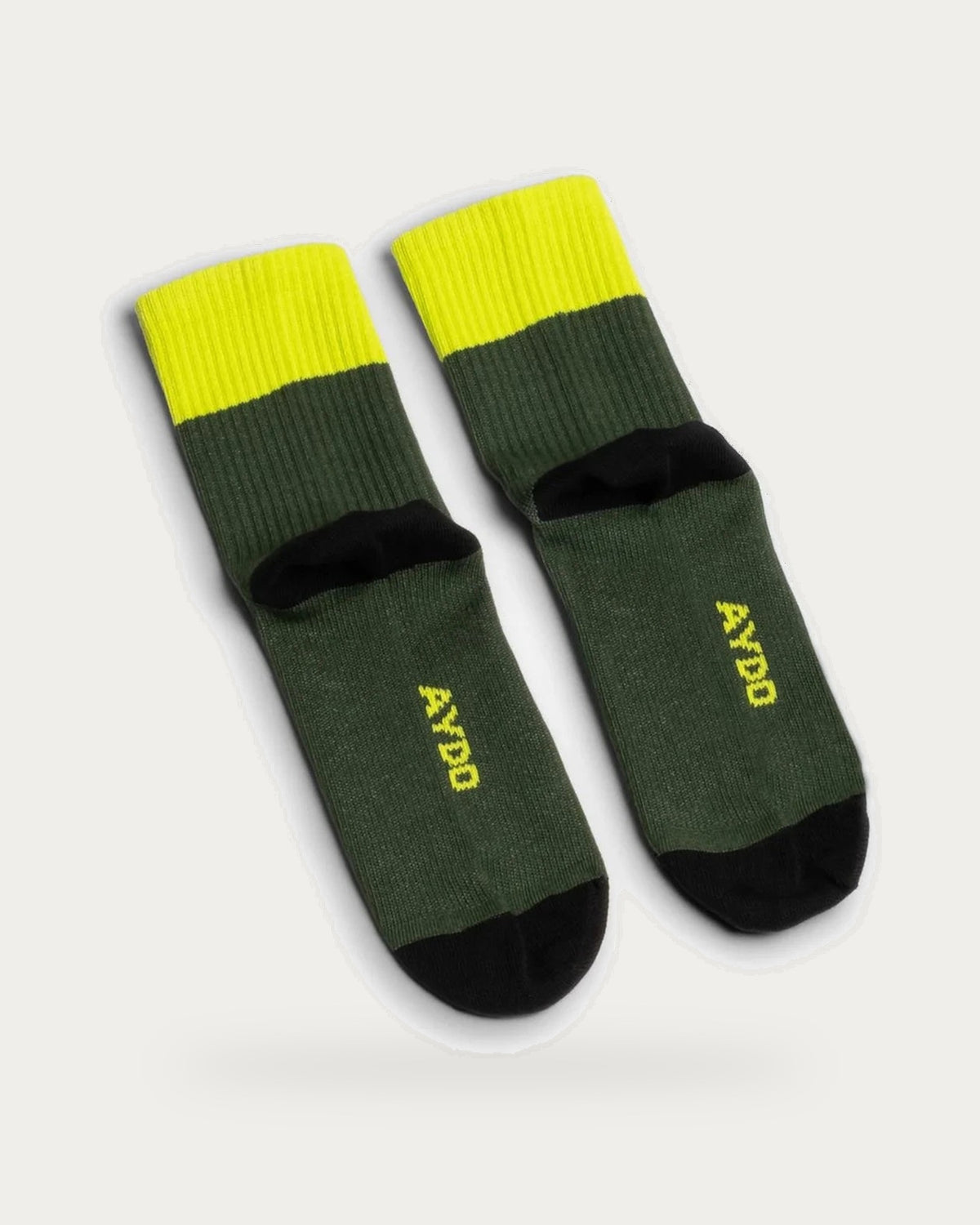 Aydo Studios Altai Route Verdant Pulse Socks – pair of socks on soft stone background