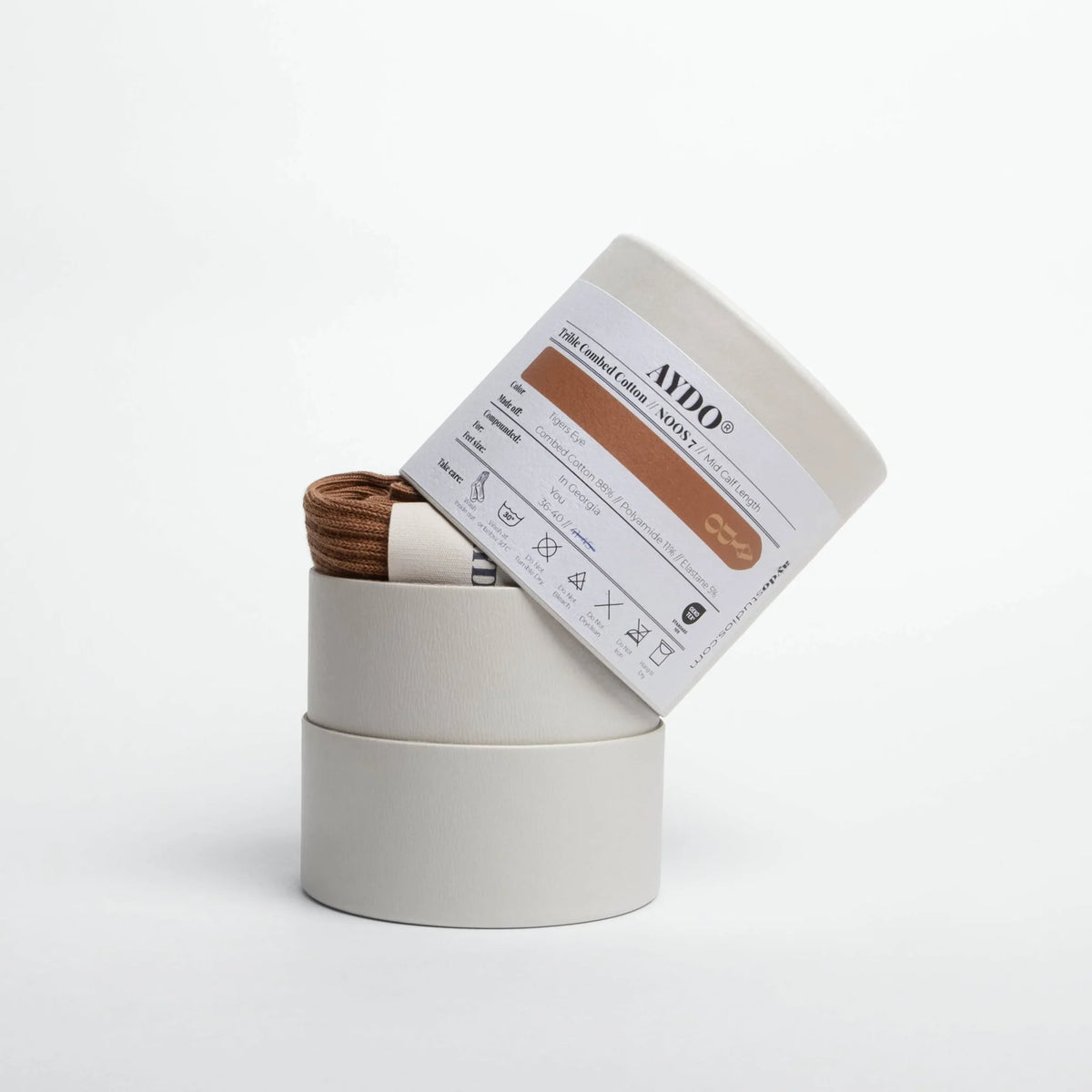 Aydo Studios Copenhagen socks in Tigers Eye, signature tube packaging