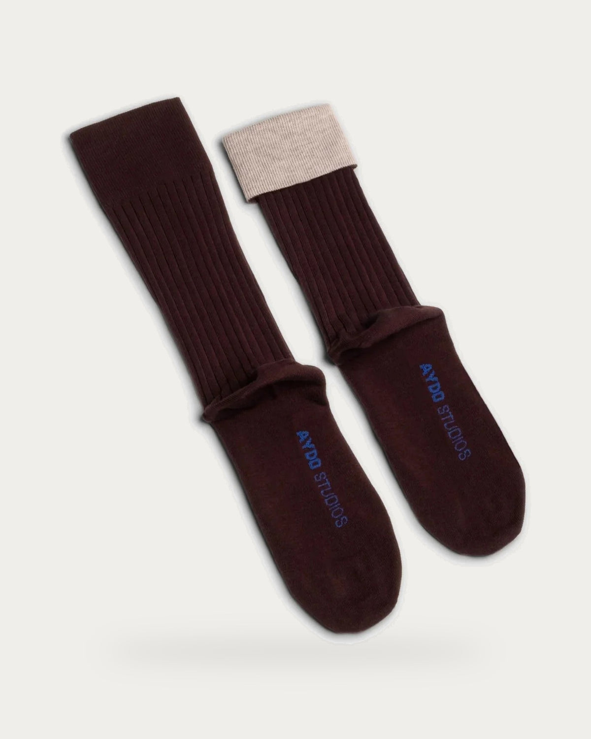 Aydo Studios Lublin Rhythm Blush Thread Socks – pair of socks on soft stone background