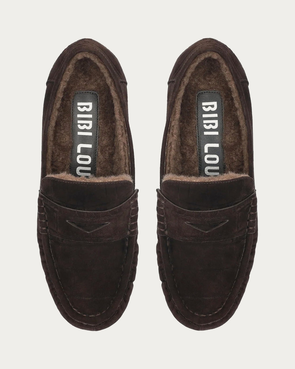 Pair of BiBi Lou Lyra brown suede loafers from above with shearling lining