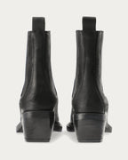 Pair of Copenhagen Studios black nubuck Chelsea boots with angled block heels, back view