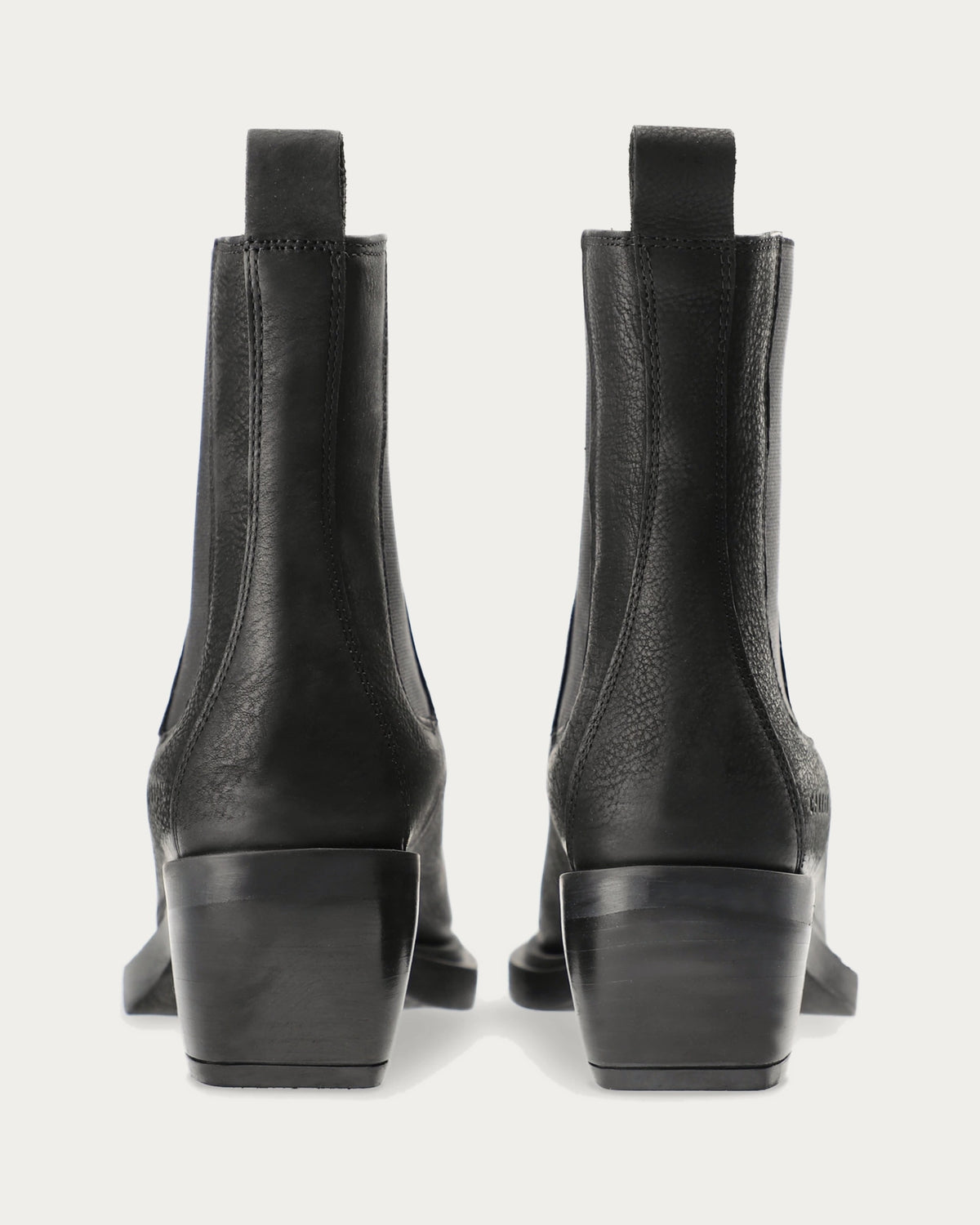 Pair of Copenhagen Studios black nubuck Chelsea boots with angled block heels, back view