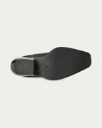 Copenhagen Studios black nubuck Chelsea boot with black sole and angled block heel, sole view