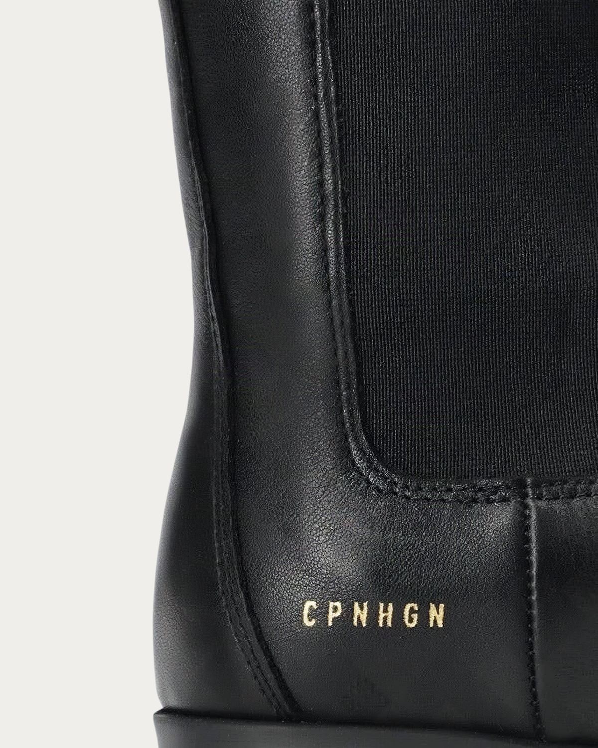 Gold CPNHGN logo on the heel of the Copenhagen Studios CPH500 Chelsea boot