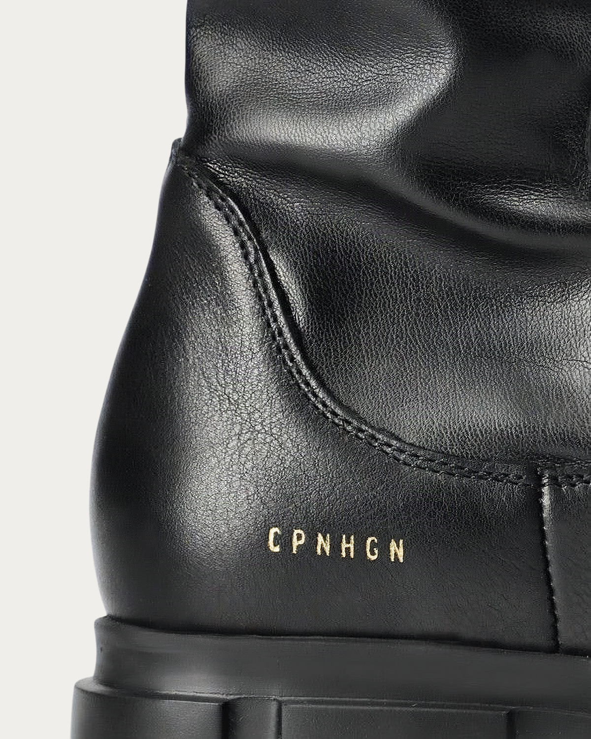Gold CPNHGN logo on the heel of the Copenhagen Studios CPH556 long boot