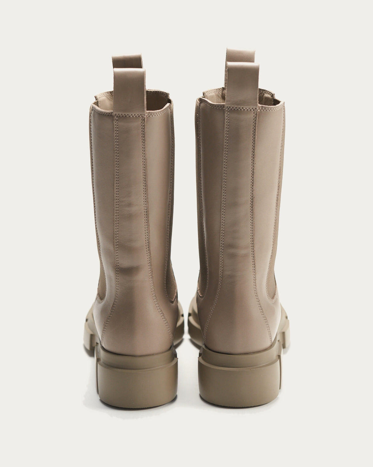 Pair of Copenhagen Studios fango leather Chelsea boots, back view with block heel