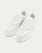 Pair of Copenhagen Studios white platform sneakers, angled view of perforated toe caps