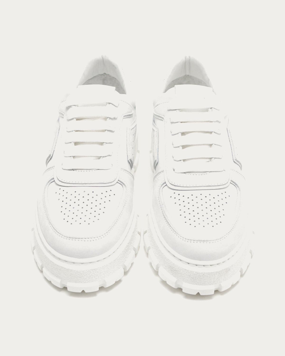 Pair of Copenhagen Studios white platform sneakers, front view with laces and chunky tread sole