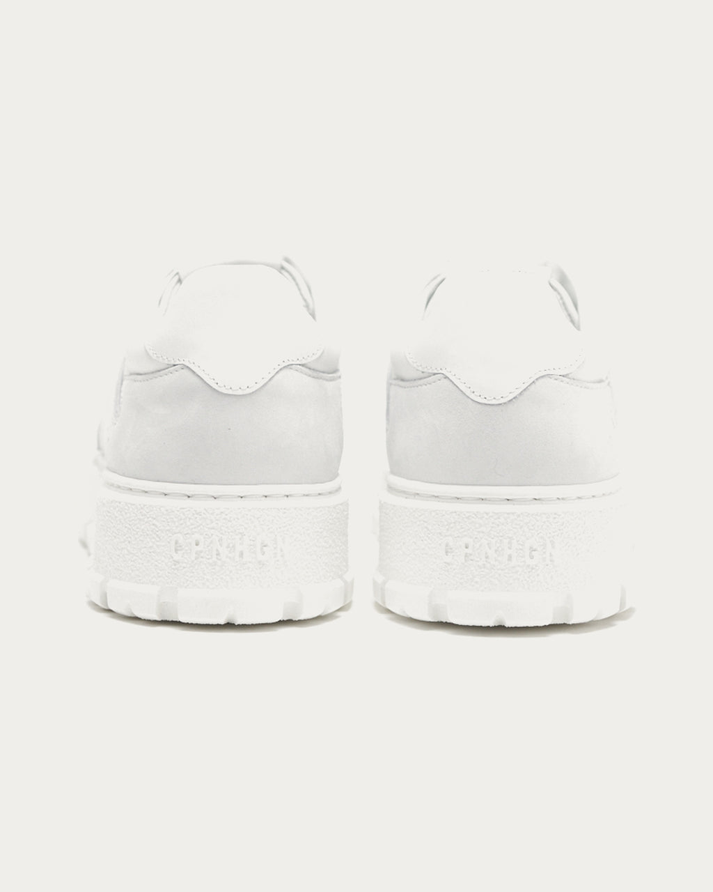 Pair of Copenhagen Studios white platform sneakers, back view with embossed heel logo