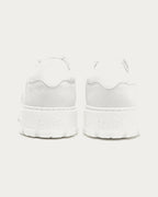Pair of Copenhagen Studios white platform sneakers, back view with embossed heel logo