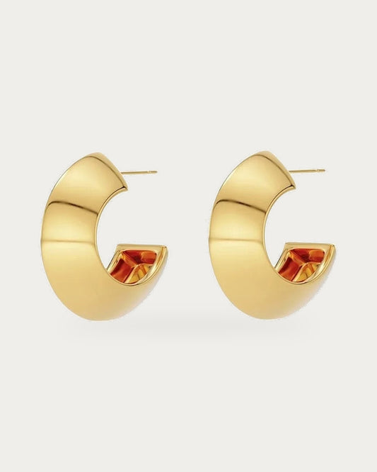 Edblad Bead Large Creole Earrings In Gold, a pair of chunky gold creole hoop earrings with asymmetrical triangle shapes, product photo on a soft off-white background