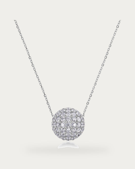 Edblad Bead Sparkle Necklace In Steel, a silver chain necklace with a large sphere pendant covered in clear stones, product photo on a soft off-white background