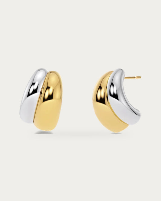 Edblad Furo Duo Stud Earring In Gold And Steel, a pair of rounded two-tone stud earrings in polished gold and steel shown front and side, product photo on a soft off-white background