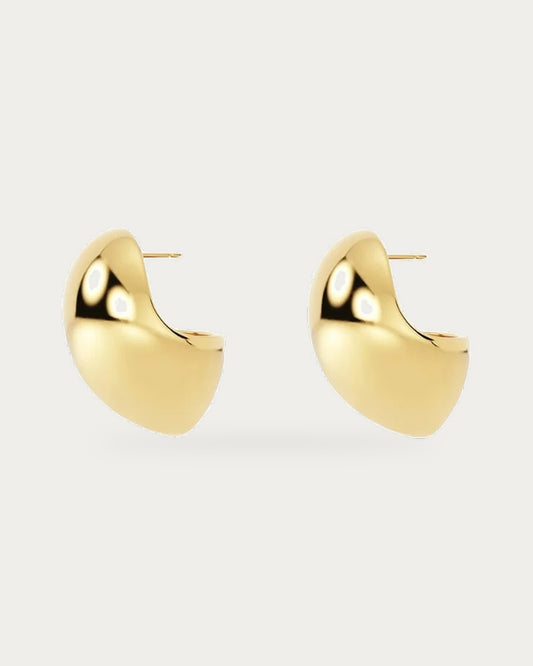 Edblad Gallant Maxi Stud Earrings In Gold, a pair of large polished gold domed stud earrings in side profile, product photo on a soft off-white background