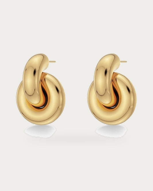 Edblad Redondo Large Stud Earrings In Gold, a pair of chunky rounded gold stud earrings, product photo on a soft off-white background