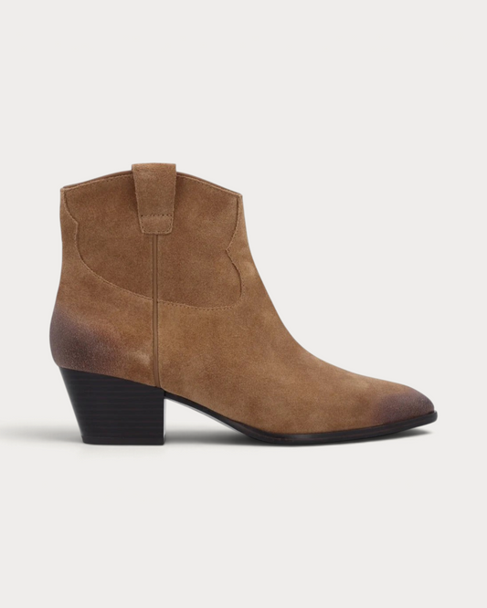 Amari Shoes & Fashion Cork Ash Fame mid-heel western boots in distressed beige leather with a pointed toe.