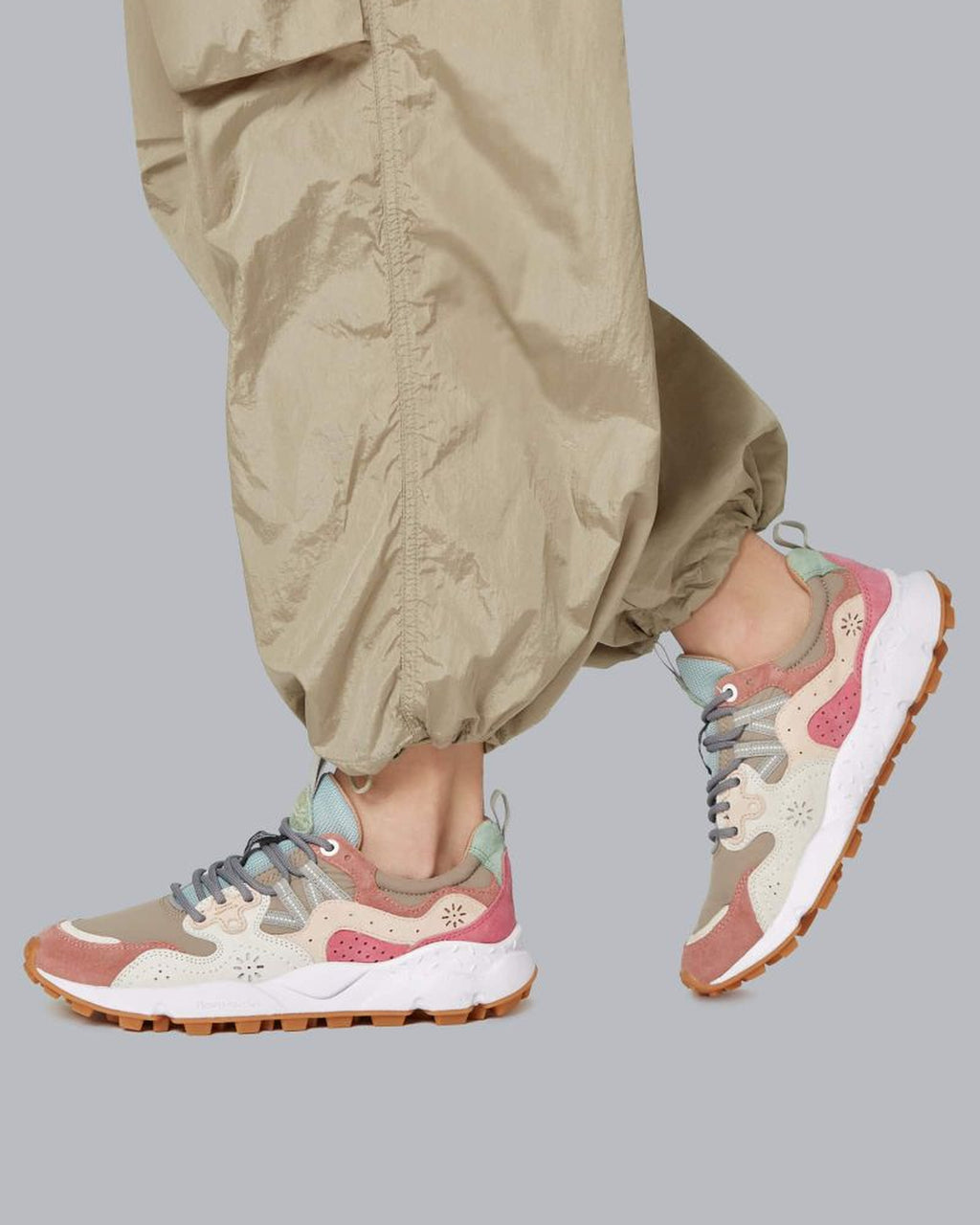 Model wearing Flower Mountain Yamano 3 Cipria Beige sneakers with khaki cargo trousers