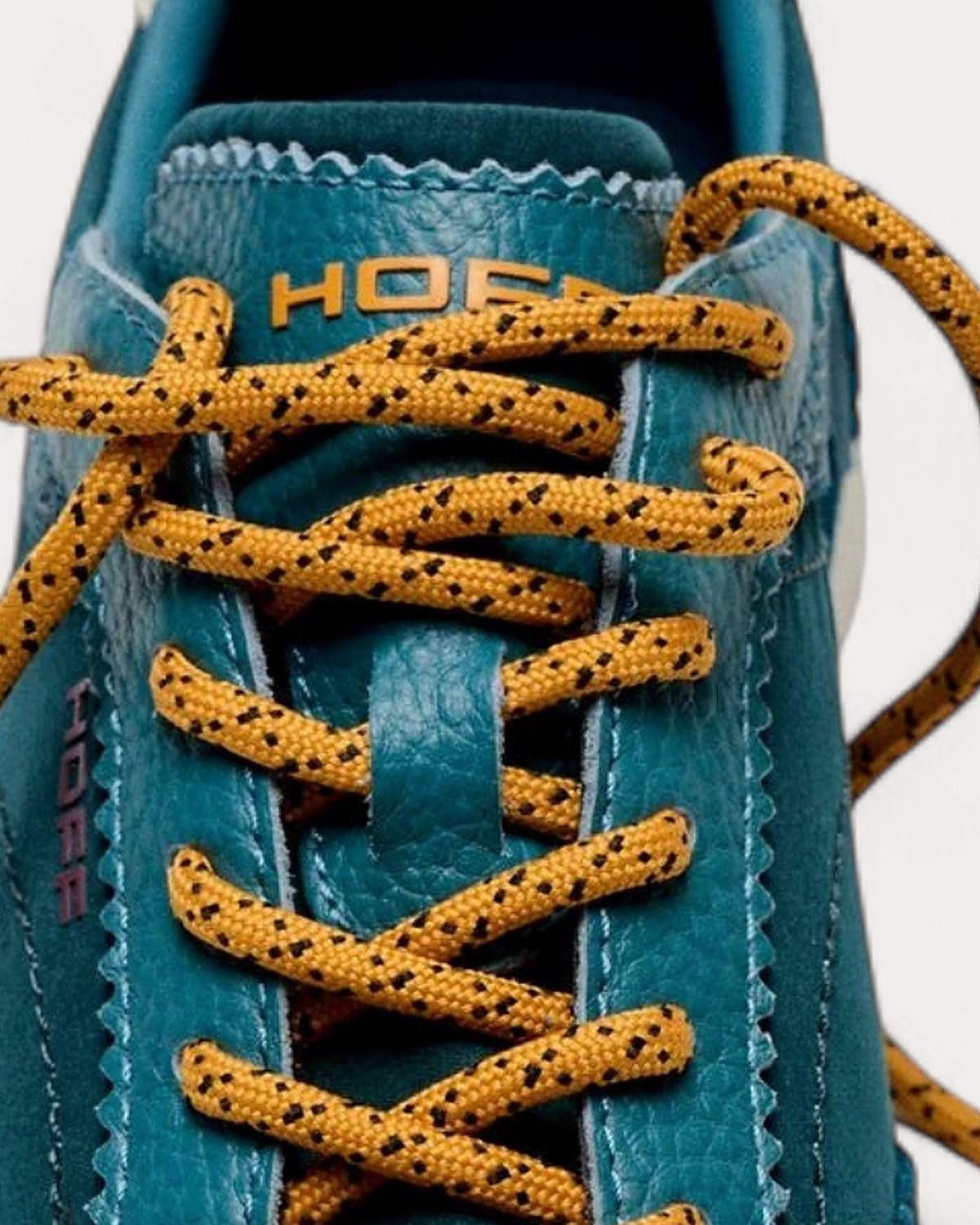 Hoff Bridge Mk sneaker in teal - tongue logo detail