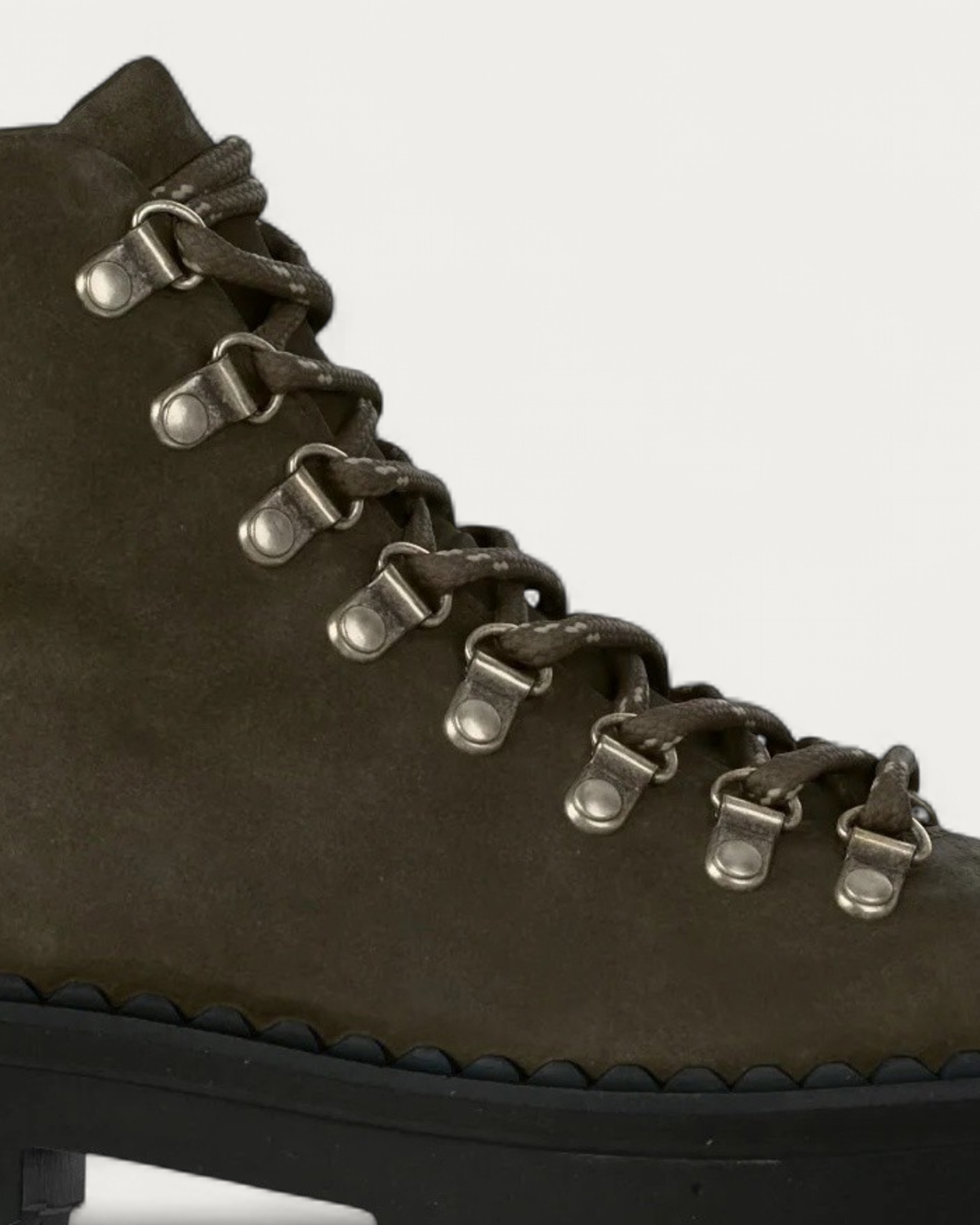 Close-up of the metal lace hooks and olive suede on the Kennel & Schmenger Lana hiking boot