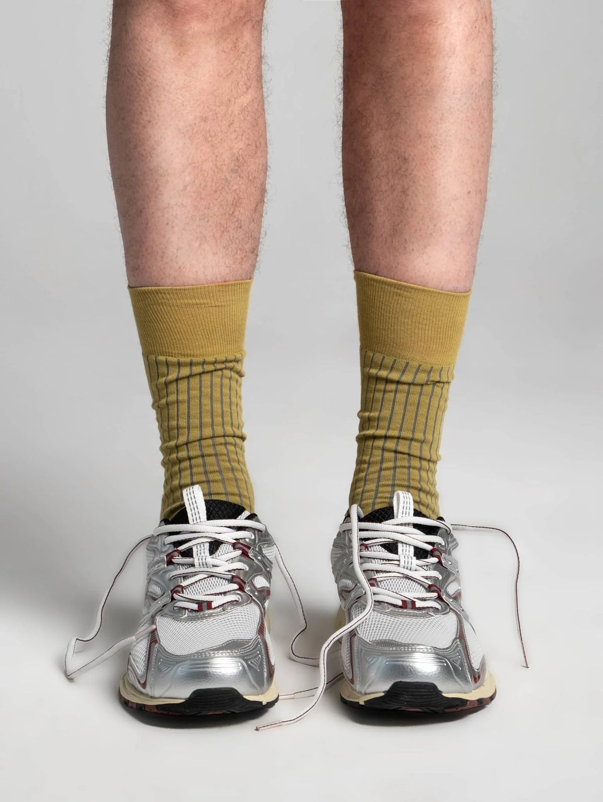 Aydo Studios Lublin Rhythm socks in Rust Pulse, worn with trainers