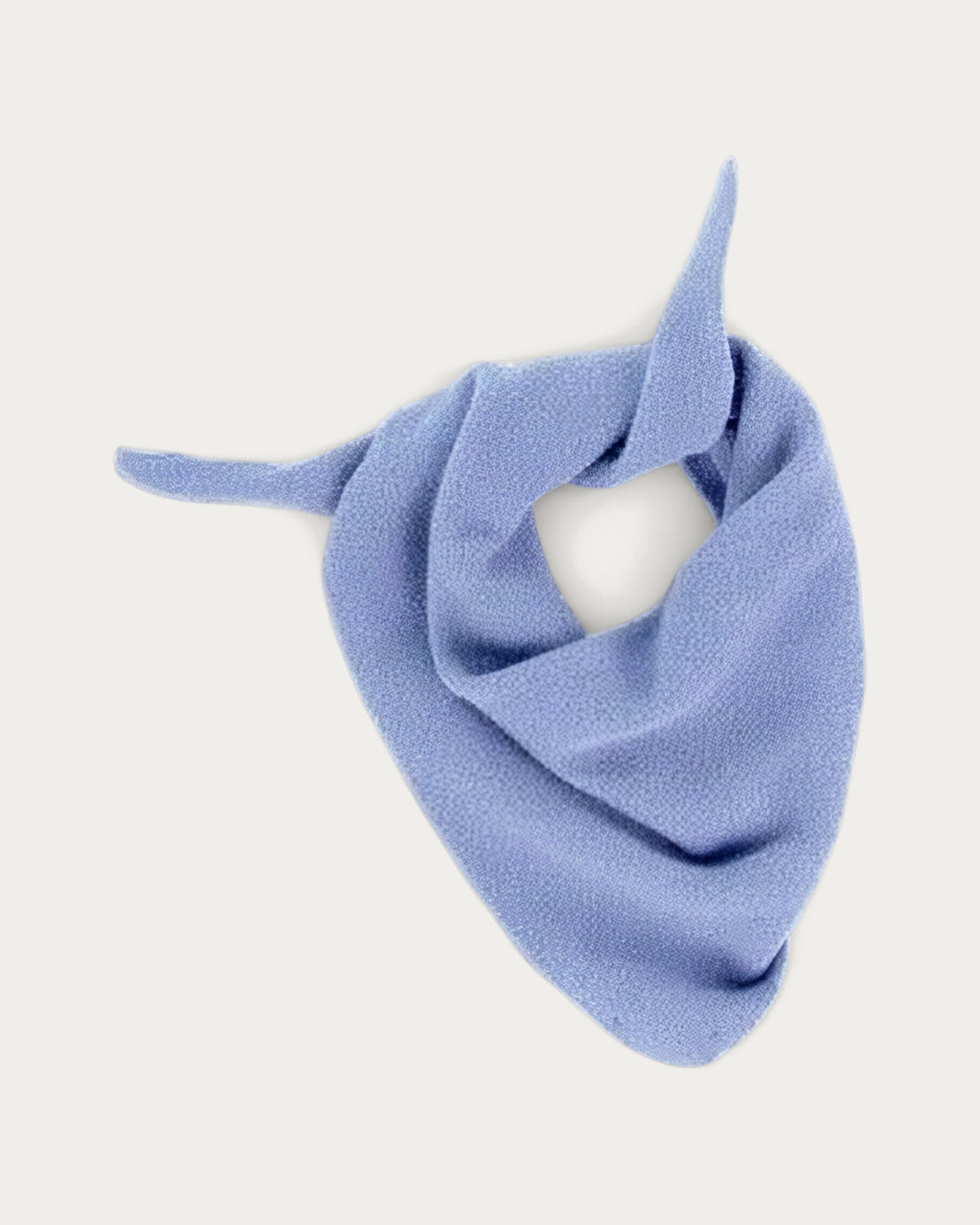 Le Bonnet Wool Bandana in Light Blue Sky, a pale blue knotted wool bandana, product photo on a soft off-white background