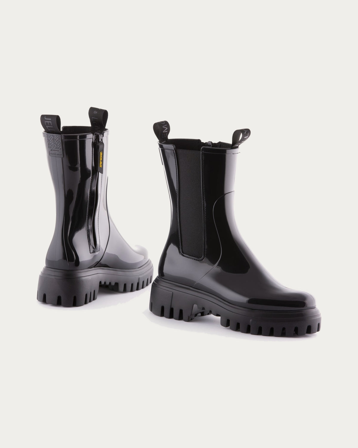Pair of Lemon Jelly City black waterproof rain boots, angled view