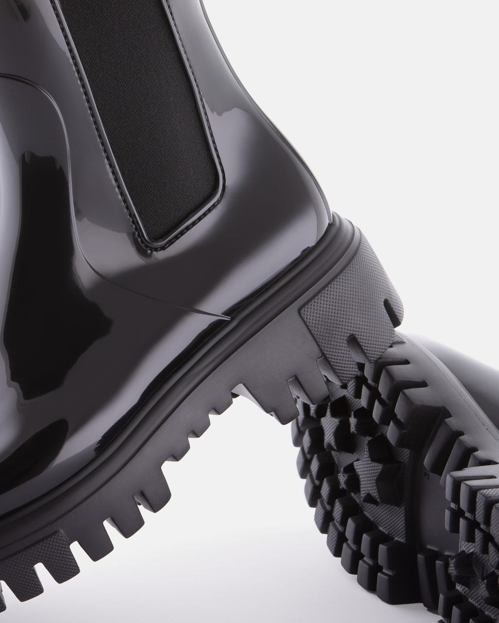Lemon Jelly City black rain boot, heel and lugged sole detail