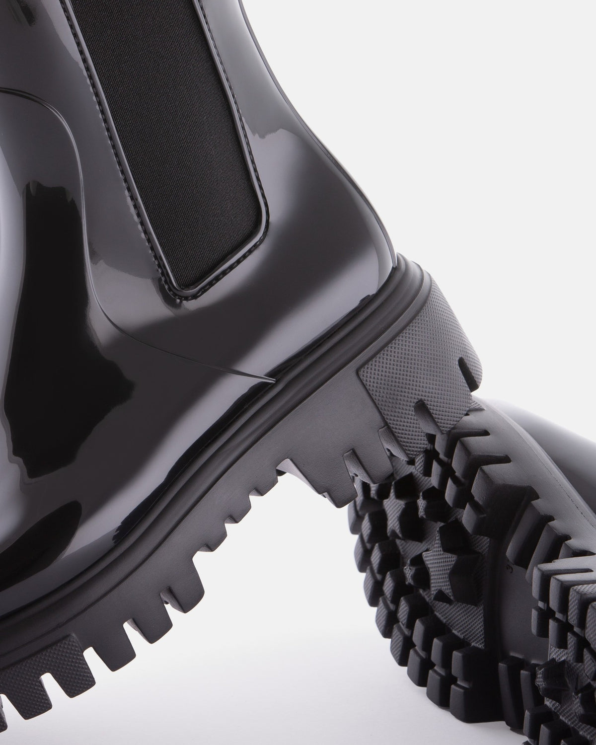 Lemon Jelly City black rain boot, heel and lugged sole detail