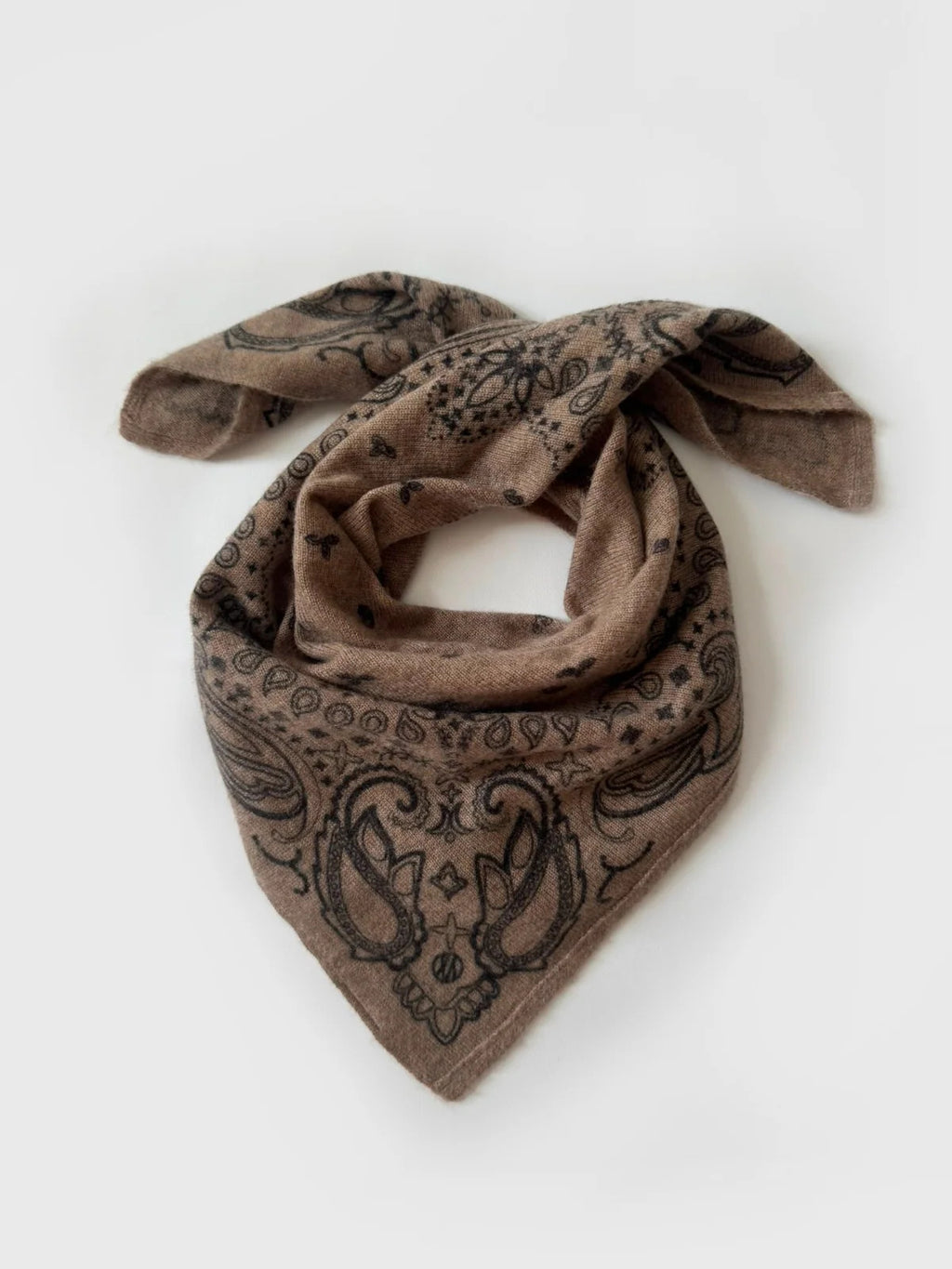 Lescarf cashmere paisley scarf in greige with black print, laid flat and loosely draped