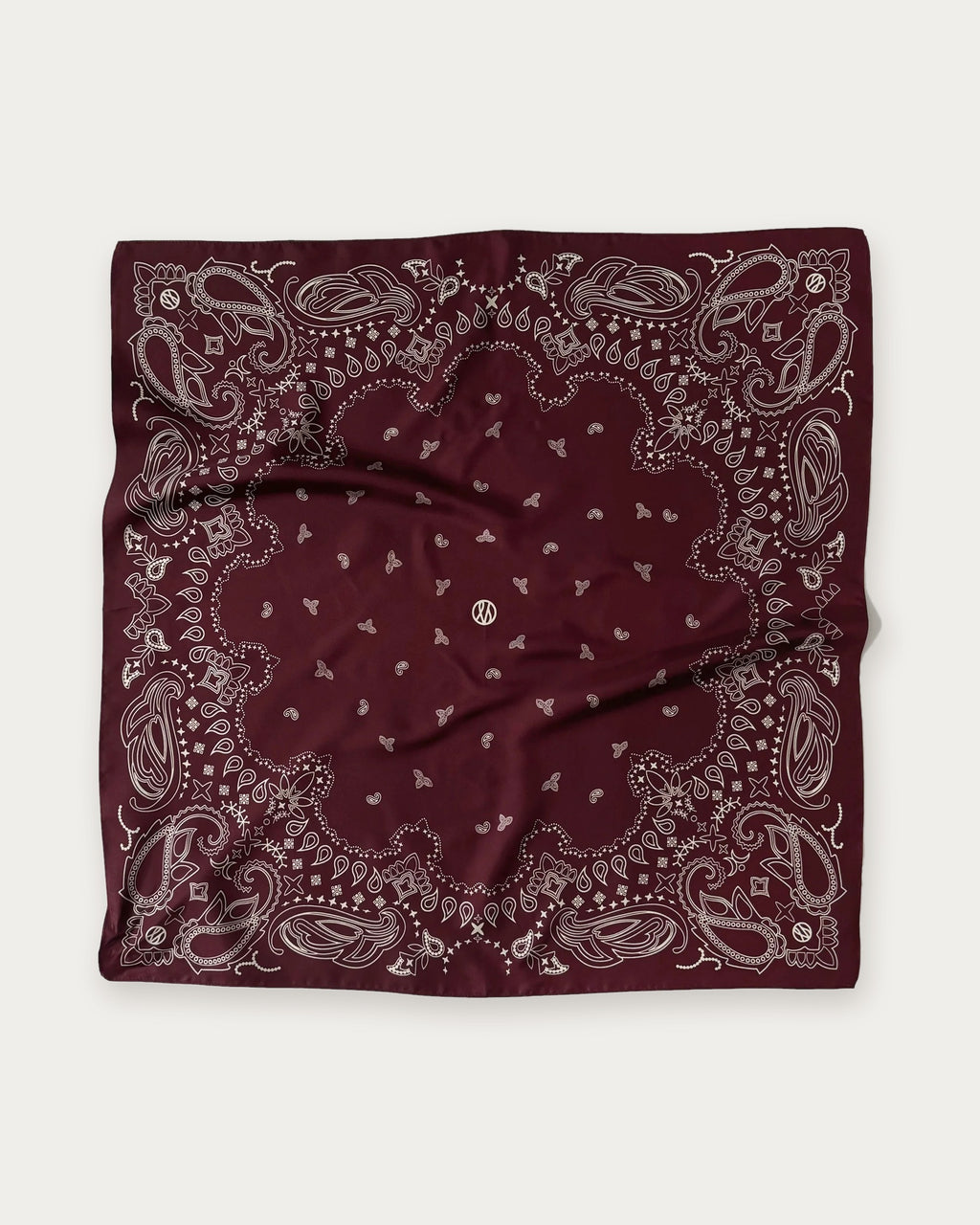 Lescarf Paisley Scarf in Wine Red, flat lay showing the white paisley print and border on wine red silk