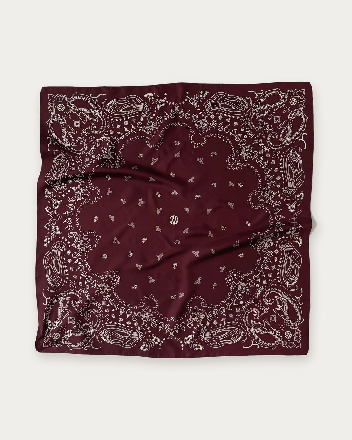 Lescarf Paisley Scarf in Wine Red, flat lay showing the white paisley print and border on wine red silk